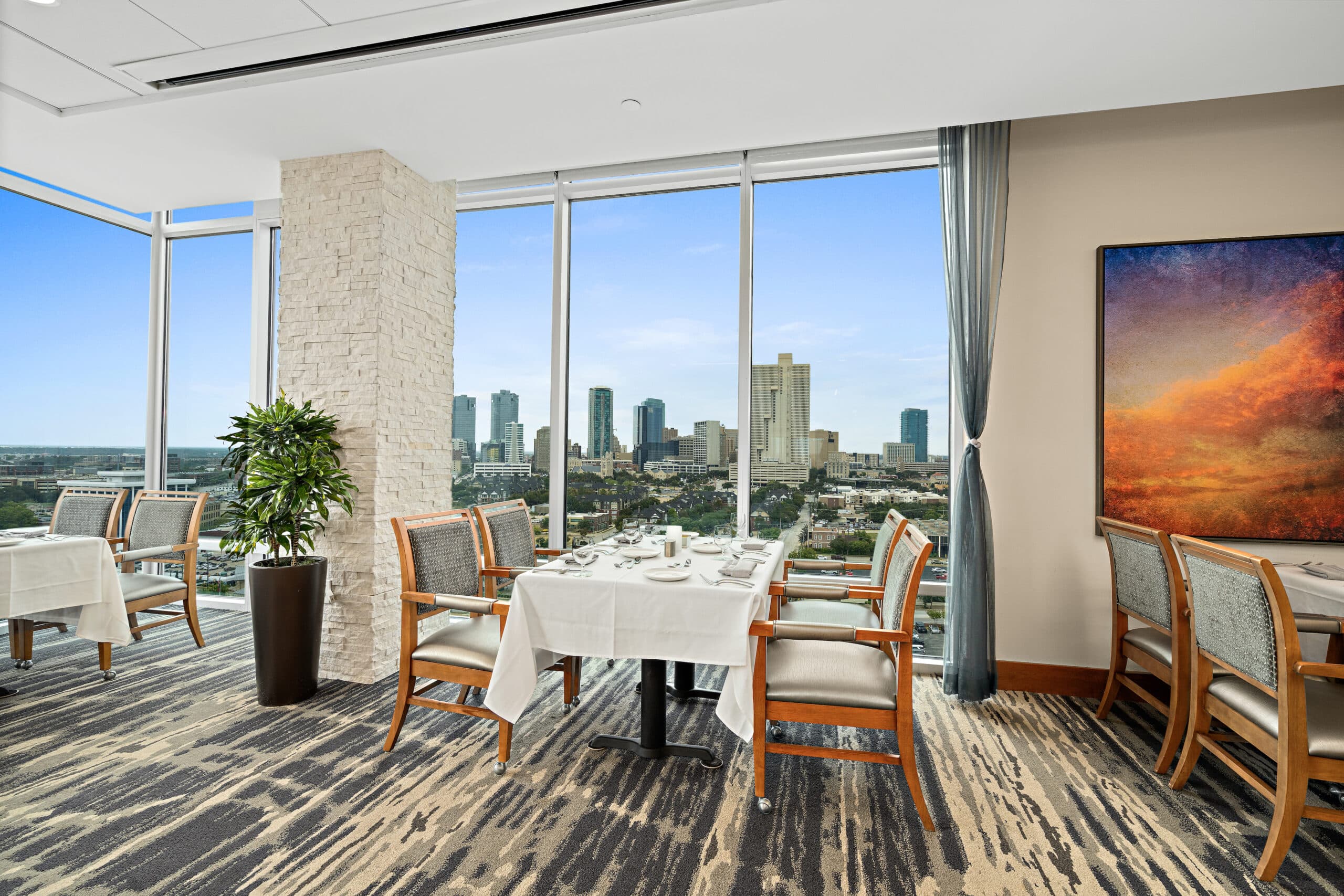 A living space with large windows at Trinity Terrace.